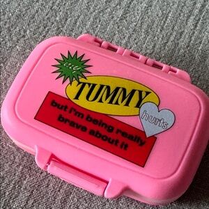 NWOT PILL CASE MY TUMMY HURTS BUT I’M BEING REAL BRAVE ABOUT IT PINK
